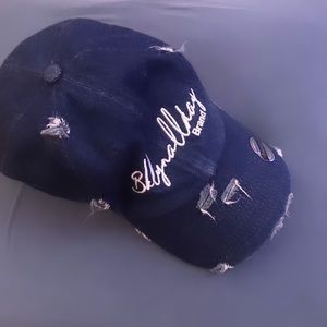 This is a not worn custom blue Jean hat, with small rips as a design